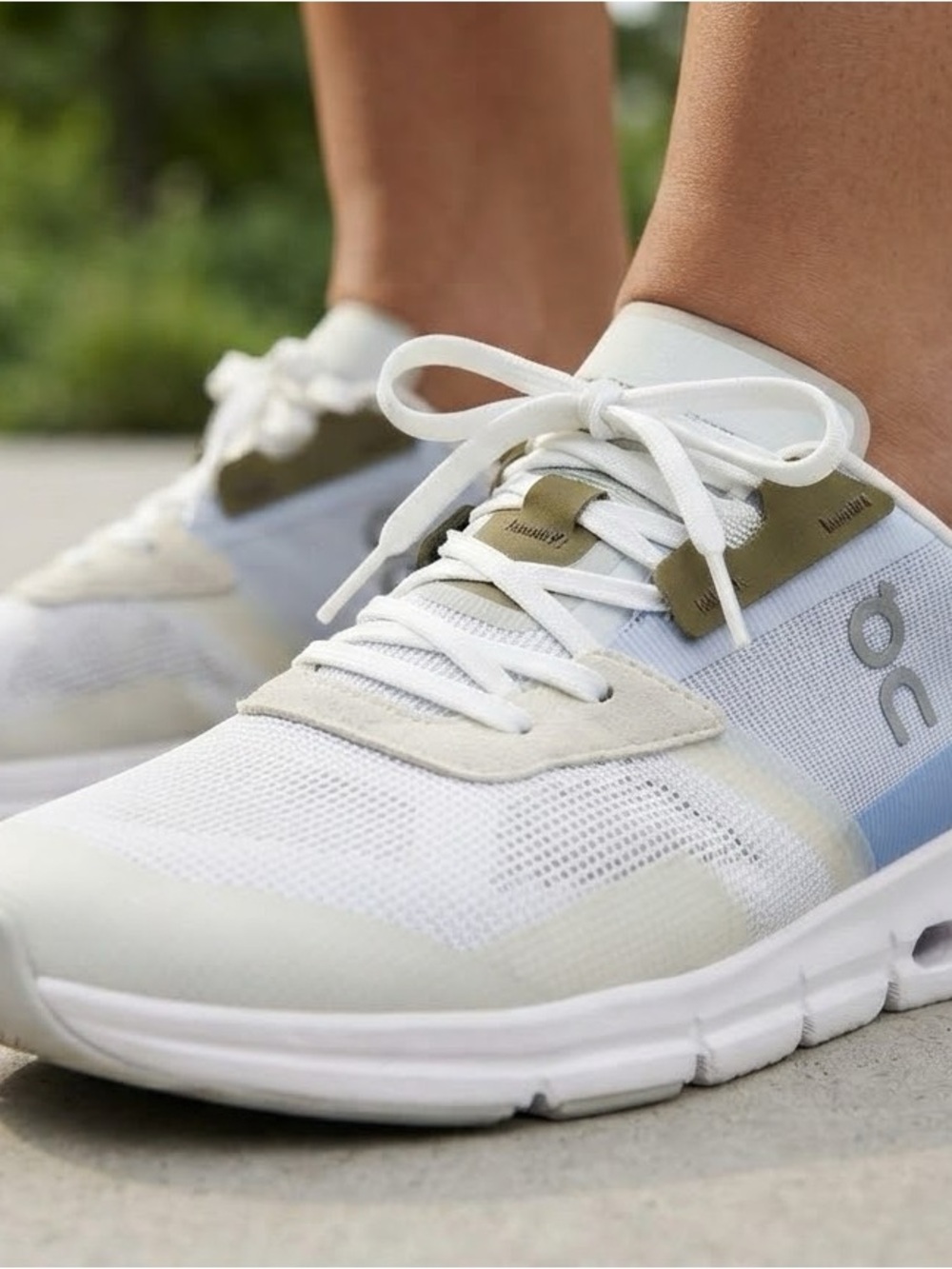 On Running White and Olive Women's Lightweight Running Sneakers